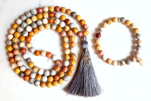 Aria Mala Atelier's unique one-of-a-kind sky eye jasper gemstone meditation japa mala with hamsa is for yoga meditation spiritual daily practise intention