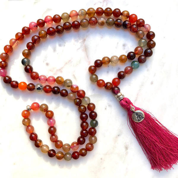 Aria Mala Atelier's unique one-of-a-kind red agate gemstone meditation japa mala with yoga figure charm is for yoga meditation empowering spiritual daily practise and intention setting
