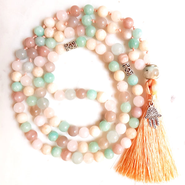 Aria Mala Atelier's unique one-of-a-kind blue turquoise pink amazonite aquamarine sunstone jade gemstone meditation japa mala with silver Hamsa charm is for yoga meditation empowering spiritual daily practise and intention setting