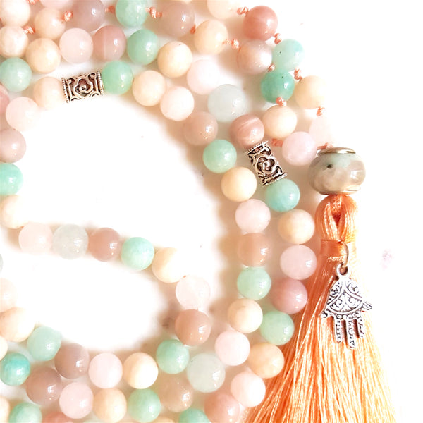 Aria Mala Atelier's unique one-of-a-kind blue turquoise pink amazonite aquamarine sunstone jade gemstone meditation japa mala with silver Hamsa charm is for yoga meditation empowering spiritual daily practise and intention setting