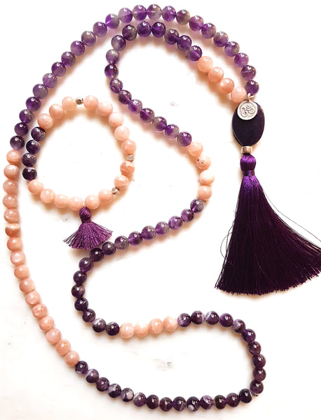 Aria Mala Atelier's unique one-of-a-kind sparkling sun stone and amethyst gemstone meditation japa mala with silver OM symbol charm is for yoga meditation empowering spiritual daily practise and intention setting