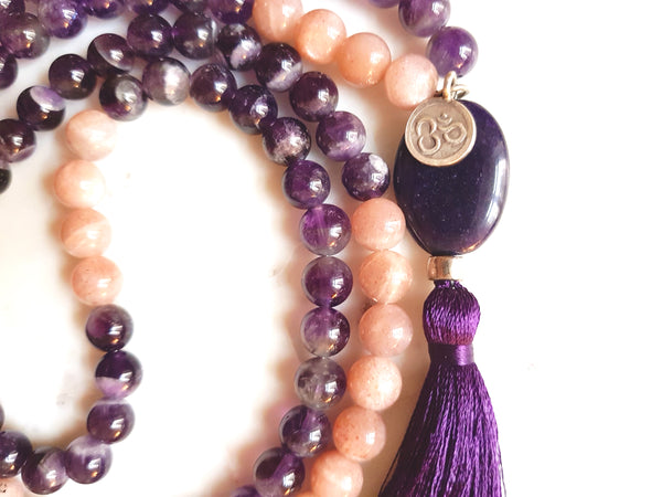 Aria Mala Atelier's unique one-of-a-kind sparkling sun stone and amethyst gemstone meditation japa mala with silver OM symbol charm is for yoga meditation empowering spiritual daily practise and intention setting