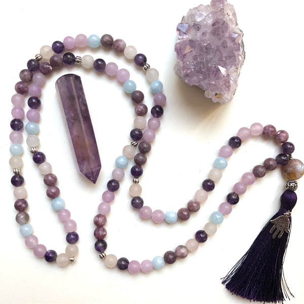 Aria Mala Atelier's unique one-of-a-kind Aquamarine, Quartz, Amethyst, Lepidolite, Jade gemstone meditation japa mala with silver hamsa charm is for yoga meditation empowering spiritual, mindfulness daily practise and intention setting