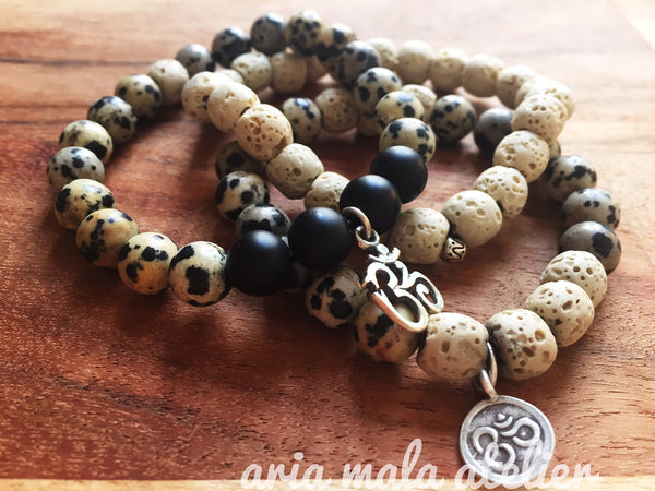 Aria Mala Atelier's unique one-of-a-kind Onyx, lavastone yoga bracelet with sterling silver OM charm for spiritual living