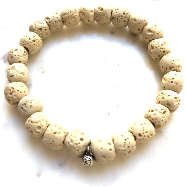 Aria Mala Atelier's unique one-of-a-kind white lavastone with little sterling silver yoga charm for spiritual living