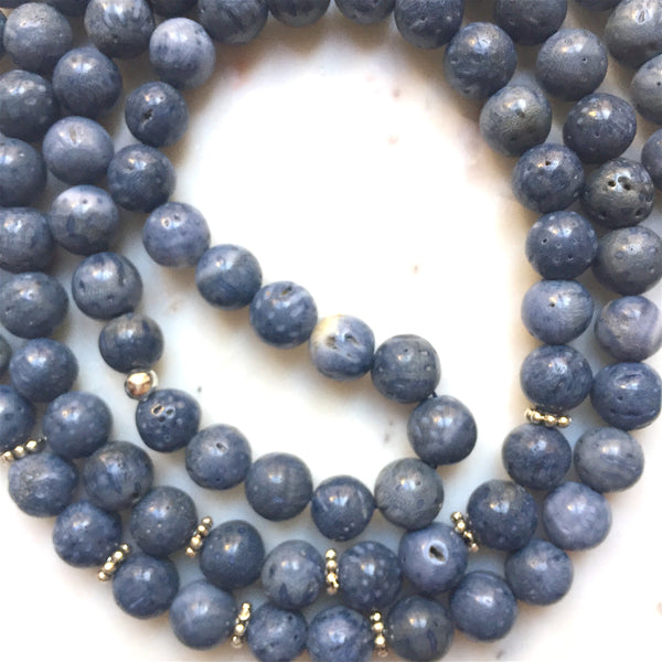 Aria Mala Atelier's unique one-of-a-kind blue coral gemstone meditation japa mala with angel wing silver charm is for yoga meditation empowering spiritual daily practise and intention setting