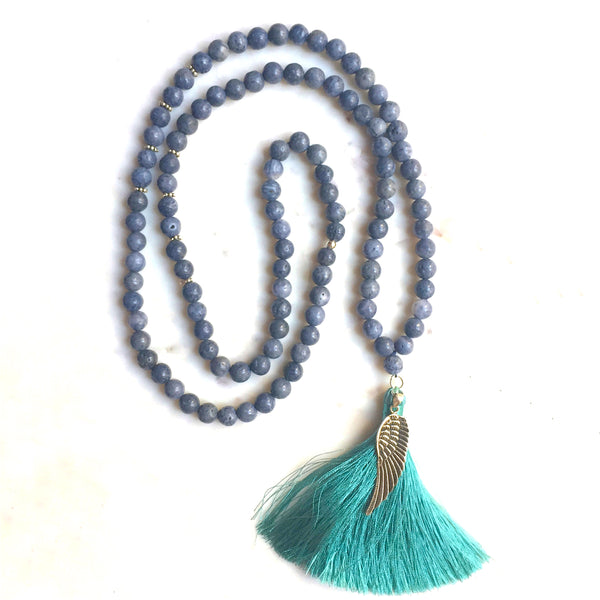 Aria Mala Atelier's unique one-of-a-kind blue coral gemstone meditation japa mala with angel wing silver charm is for yoga meditation empowering spiritual daily practise and intention setting