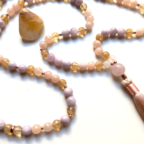 Aria Mala Atelier's unique one-of-a-kind Kunzite,morganite, citrine gemstone meditation japa mala with rose quartz guru bead is for yoga meditation empowering spiritual daily practise and intention setting