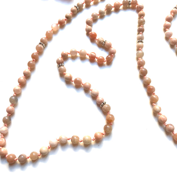 Aria Mala Atelier's unique one-of-a-kind feminine power Peach Moonstone gemstone meditation japa mala with sterling silver dream catcher charm is for yoga meditation empowering spiritual daily practise and intention setting