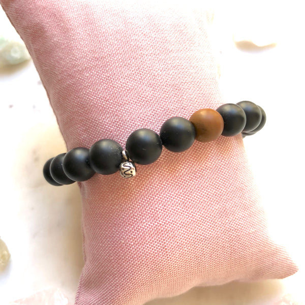 Aria Mala Atelier's unique one-of-a-kind Black Onyx with Buddha Charm (antique bronze) yoga bracelet charm for spiritual living