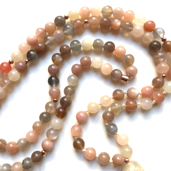 Aria Mala Atelier's unique one-of-a-kind feminine power Peach Moonstone gemstone meditation japa mala with rose color sterling silver charm is for yoga meditation empowering spiritual daily practise and intention setting