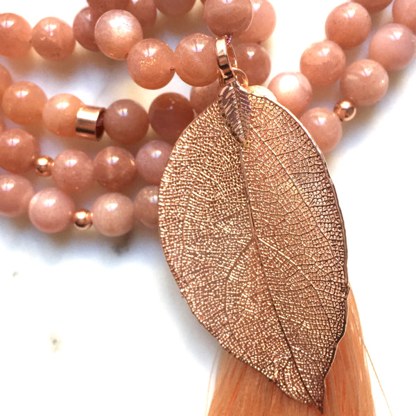 Aria Mala Atelier's unique one-of-a-kind feminine power Rose Moonstone gemstone meditation japa mala with rose leaf shape charm is for yoga meditation empowering spiritual daily practise and intention setting