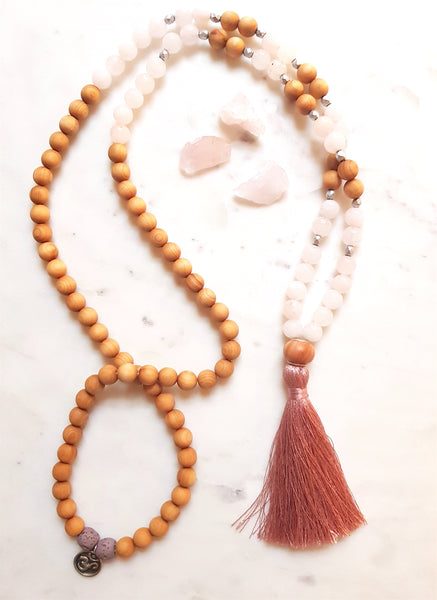 Aria Mala Atelier's unique one-of-a-kind sandal wood pink jade gemstone meditation japa mala with silver OM charm is for yoga meditation empowering spiritual daily practise and intention setting