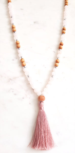 Aria Mala Atelier's unique one-of-a-kind sandal wood pink jade gemstone meditation japa mala with silver OM charm is for yoga meditation empowering spiritual daily practise and intention setting