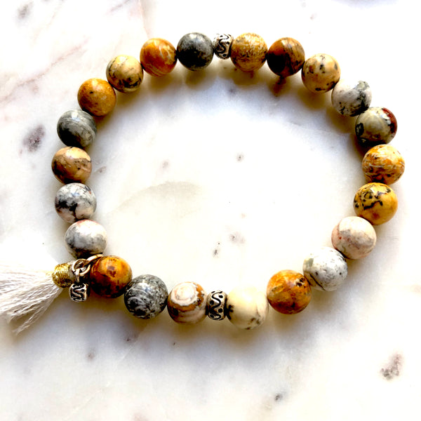 Aria Mala Atelier's unique one-of-a-kind sky eye jasper bracelet with cotton tassel for spiritual living