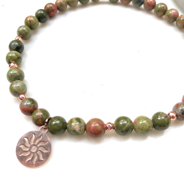 Aria Mala Atelier's unique one-of-a-kind unakite sun symbol charm for spiritual living and mindfulness practices