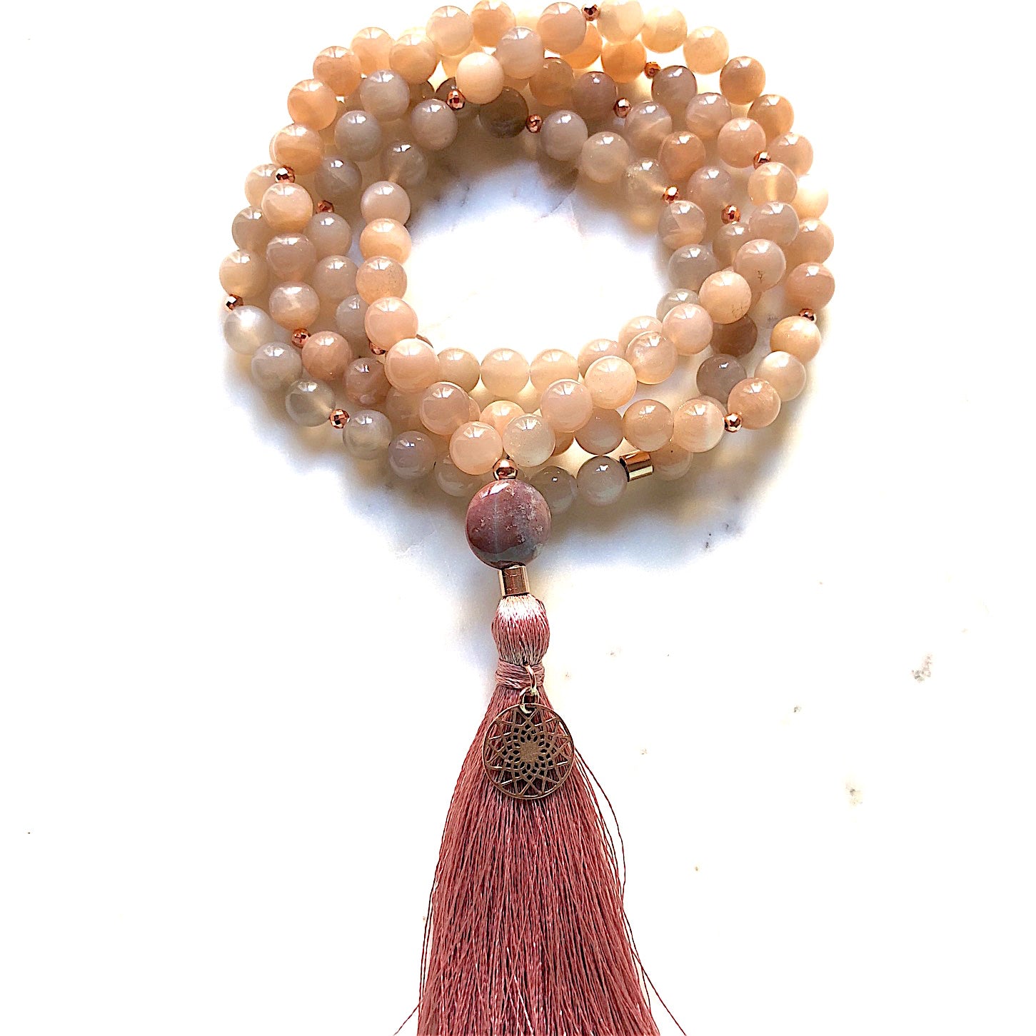 Aria Mala Atelier's unique one-of-a-kind Sunstone, Carnelian Agate gemstone mala with silver mandala charm is for yoga meditation empowering spiritual daily practise and intention setting