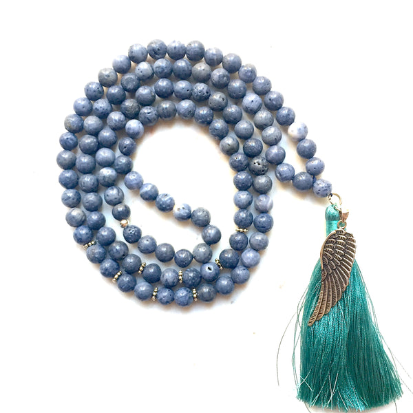 Aria Mala Atelier's unique one-of-a-kind blue coral gemstone meditation japa mala with angel wing silver charm is for yoga meditation empowering spiritual daily practise and intention setting