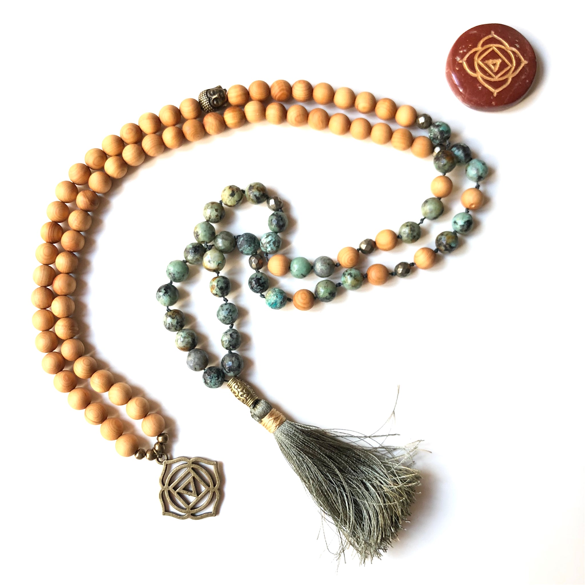 Aria Mala Atelier's unique one-of-a-kind African turquoise gemstone meditation japa mala with first (root) chakra charm is for yoga meditation empowering spiritual daily practise and intention setting