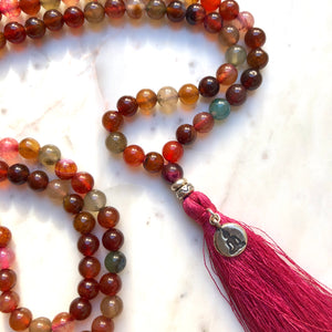 Aria Mala Atelier's unique one-of-a-kind red agate gemstone meditation japa mala with yoga figure charm is for yoga meditation empowering spiritual daily practise and intention setting