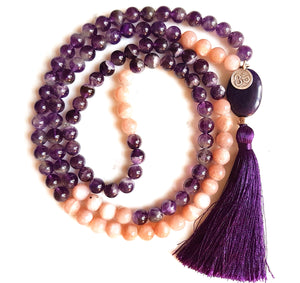Aria Mala Atelier's unique one-of-a-kind sparkling sun stone and amethyst gemstone meditation japa mala with silver OM symbol charm is for yoga meditation empowering spiritual daily practise and intention setting