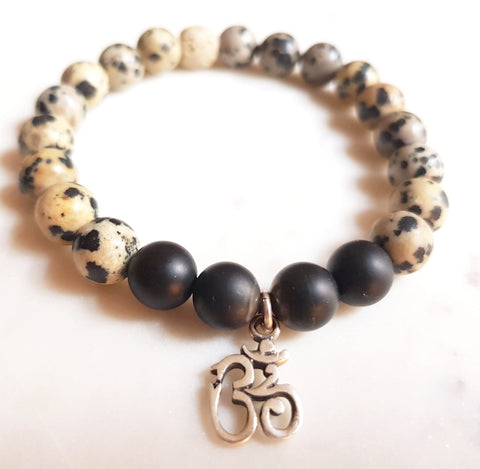 Aria Mala Atelier's unique one-of-a-kind Onyx, lavastone yoga bracelet with sterling silver OM charm for spiritual living