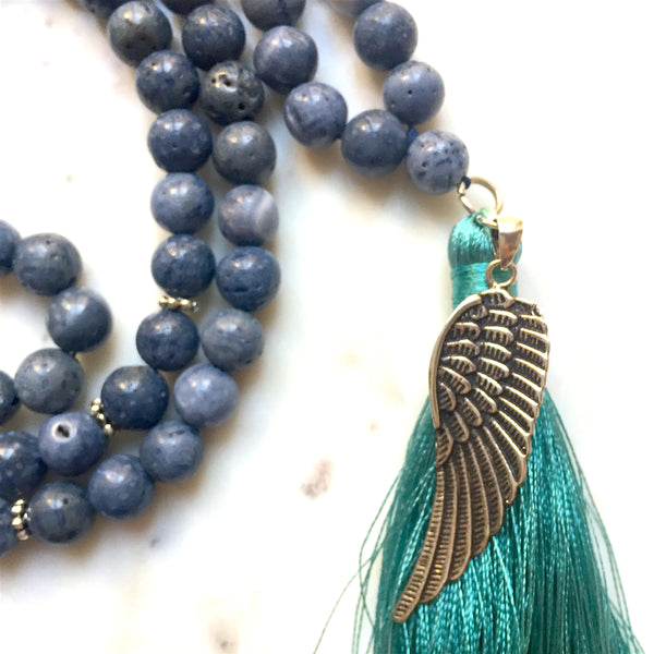 Aria Mala Atelier's unique one-of-a-kind blue coral gemstone meditation japa mala with angel wing silver charm is for yoga meditation empowering spiritual daily practise and intention setting