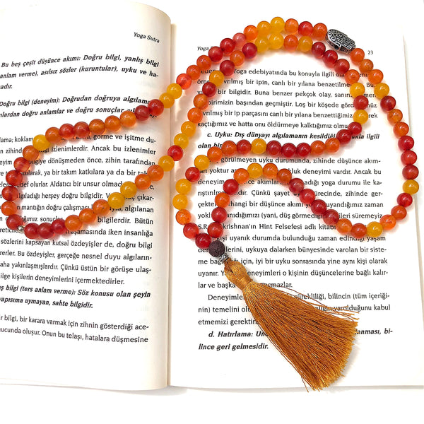Aria Mala Atelier's unique one-of-a-kind sun color agate gemstone meditation japa mala with silver hamsa charm is for yoga meditation empowering spiritual, mindfulness daily practise, intention setting