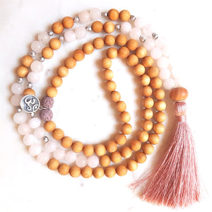 Aria Mala Atelier's unique one-of-a-kind sandal wood pink jade gemstone meditation japa mala with silver OM charm is for yoga meditation empowering spiritual daily practise and intention setting