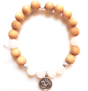 Aria Mala Atelier's unique one-of-a-kind Pink Jade yoga bracelet with sterling silver OM charm for spiritual living
