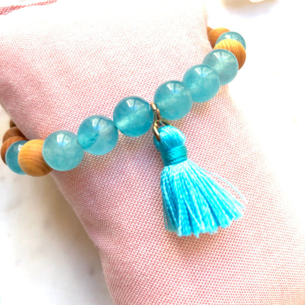 Aria Mala Atelier's unique one-of-a-kind Turquoise Jade, Natural Sandalwood yoga bracelet with cotton mini tassel for spiritual living