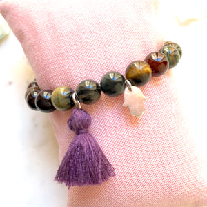 Aria Mala Atelier's unique one-of-a-kind Tiger's eye yoga bracelet with sterling silver Hamsa (Fatima's Hand) charm for spiritual living
