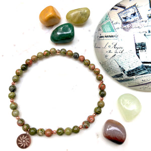 Aria Mala Atelier's unique one-of-a-kind unakite sun symbol charm for spiritual living and mindfulness practices